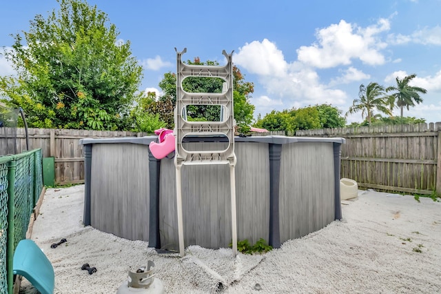 view of outdoor structure featuring a fenced backyard