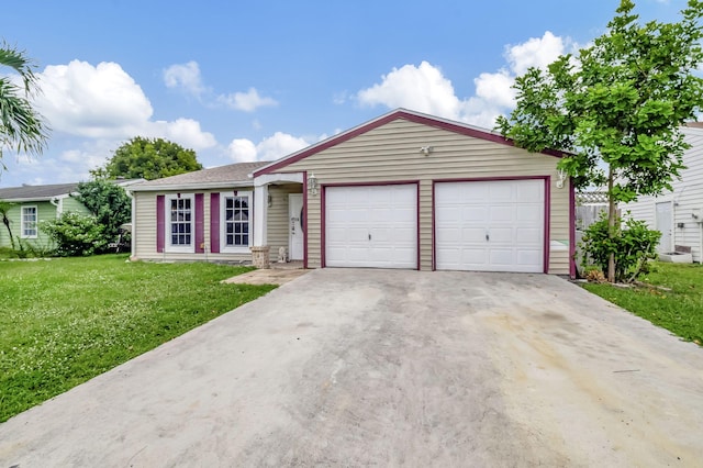 ranch-style house featuring a garage and a front lawn