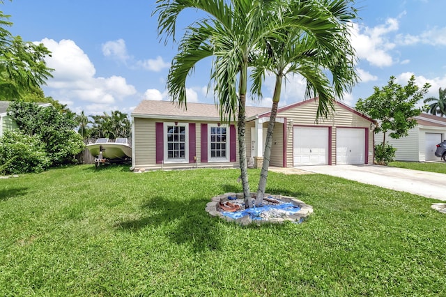 view of front of property with concrete driveway, an attached garage, and a front yard