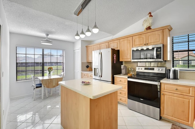 kitchen with a kitchen island, stainless steel appliances, light brown cabinetry, and light tile patterned floors