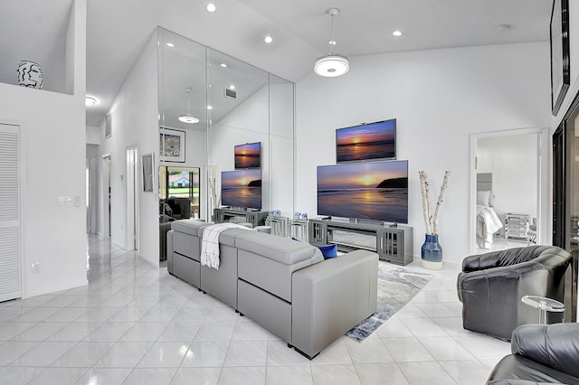 tiled living room featuring high vaulted ceiling