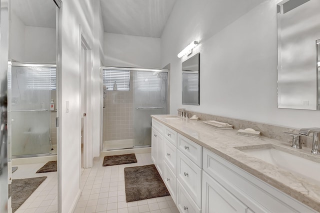 bathroom featuring tile patterned flooring and dual bowl vanity