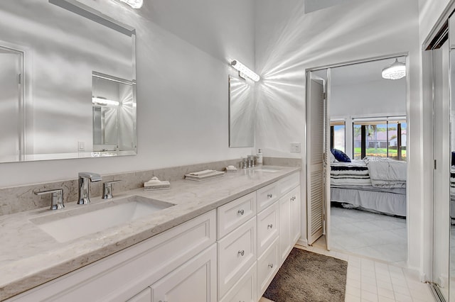 bathroom with tile patterned flooring and double vanity