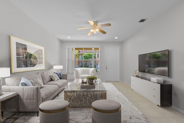 tiled living room featuring ceiling fan