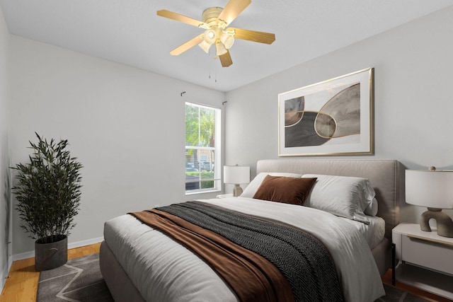 bedroom featuring ceiling fan and hardwood / wood-style flooring