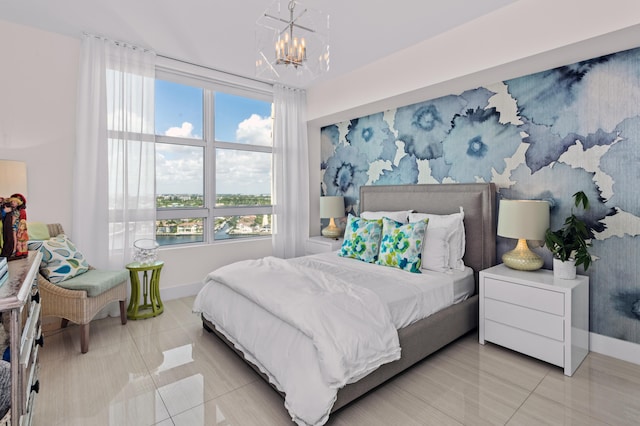 bedroom featuring a chandelier and light tile patterned floors