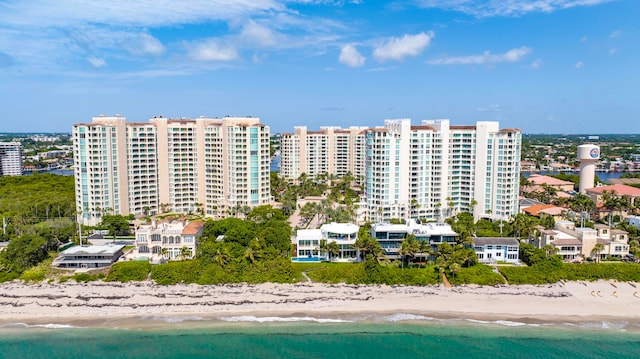 drone / aerial view with a water view and a view of the beach