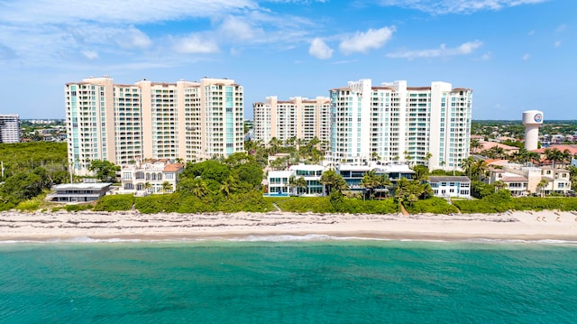 aerial view featuring a water view and a beach view