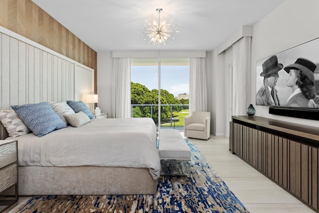 bedroom featuring a notable chandelier and wooden walls