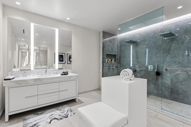 bathroom with tile patterned flooring, vanity, and a shower with shower door