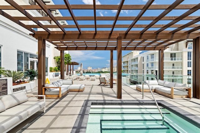 view of swimming pool featuring an outdoor living space and a pergola