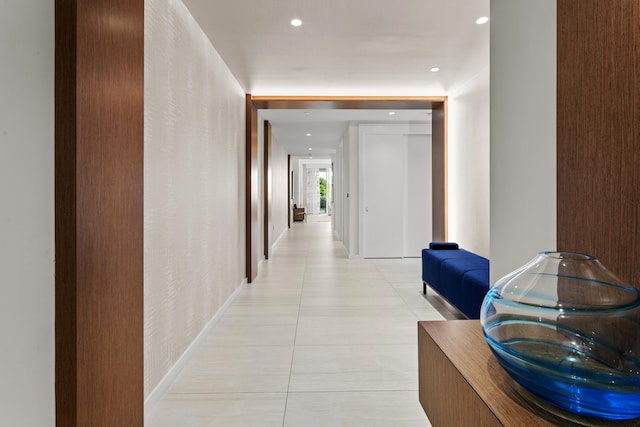 corridor featuring light tile patterned floors