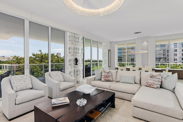 sunroom / solarium featuring an inviting chandelier