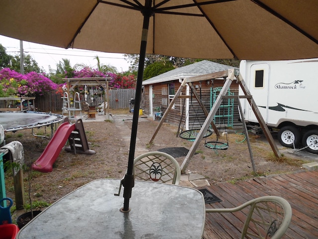 view of playground with a deck