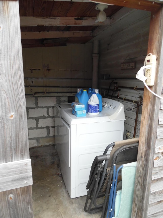 clothes washing area featuring separate washer and dryer