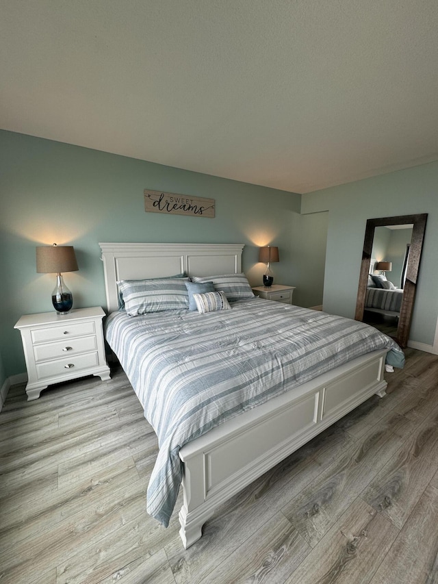 bedroom with light hardwood / wood-style flooring