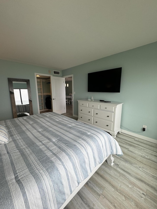 bedroom featuring light wood-type flooring