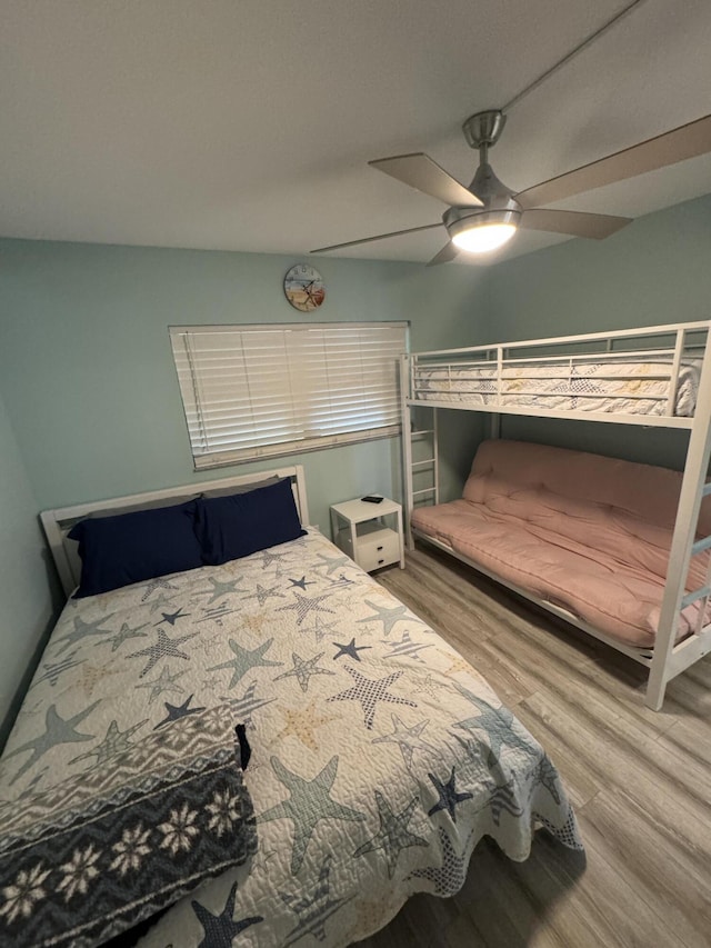 bedroom featuring ceiling fan and hardwood / wood-style floors