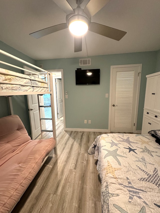 bedroom featuring light hardwood / wood-style floors and ceiling fan