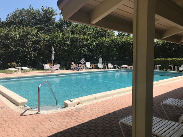 view of swimming pool with a patio