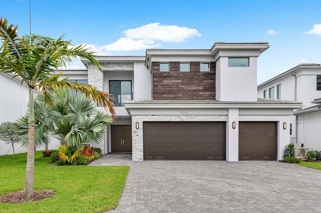 view of front facade with a garage and a front yard