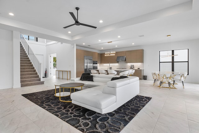 tiled living room with ceiling fan