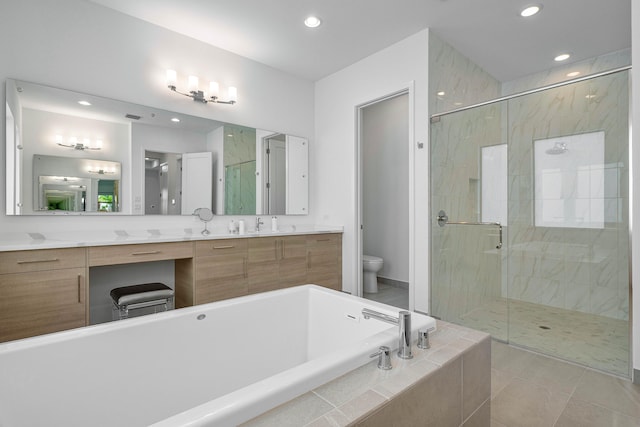 full bathroom with tile patterned floors, dual bowl vanity, plus walk in shower, and toilet