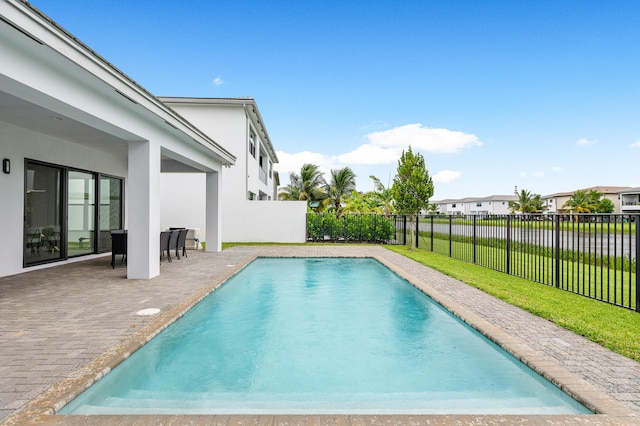 view of swimming pool with a patio area