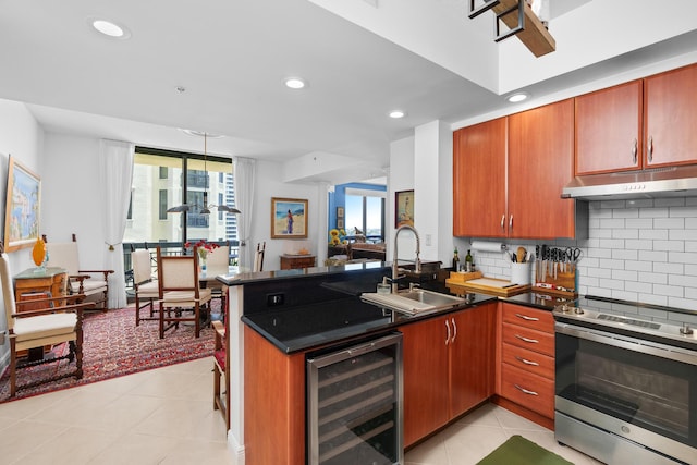 kitchen featuring wine cooler, light tile patterned flooring, under cabinet range hood, a sink, and stainless steel range with electric stovetop