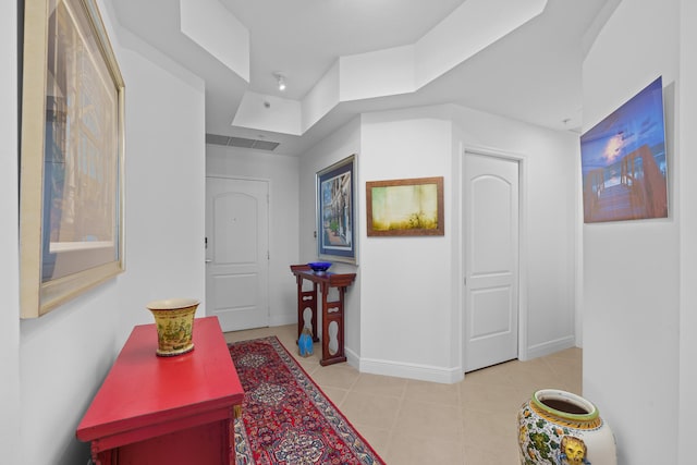 hallway featuring light tile patterned floors