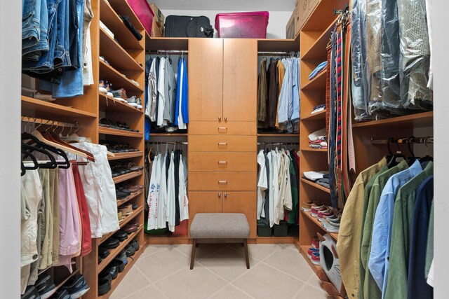 walk in closet featuring light tile patterned floors