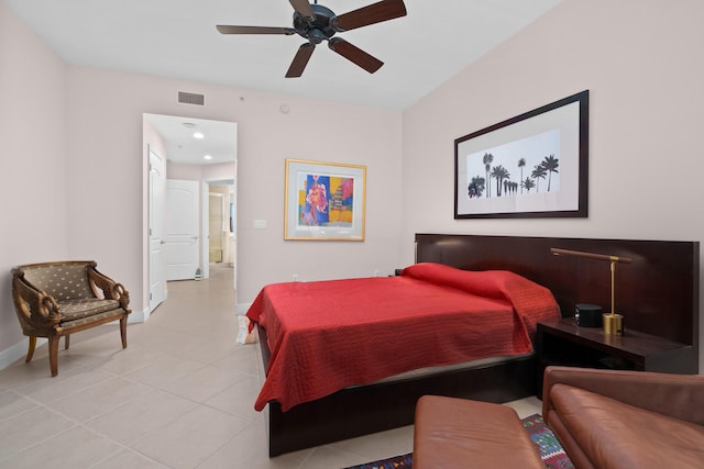 bedroom featuring light tile patterned floors, ceiling fan, visible vents, and baseboards