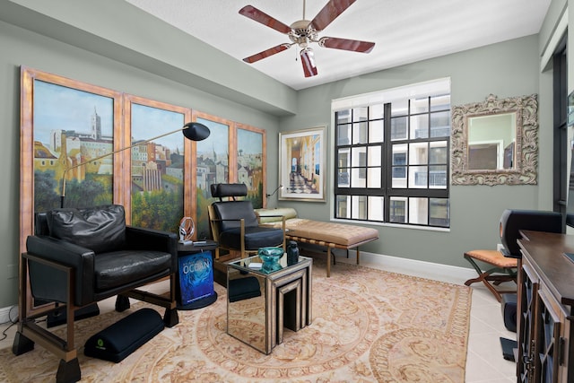 interior space with ceiling fan and light tile patterned floors