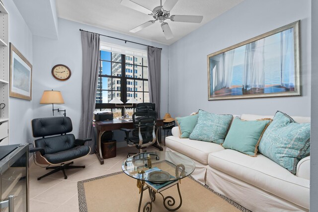 tiled living room with ceiling fan