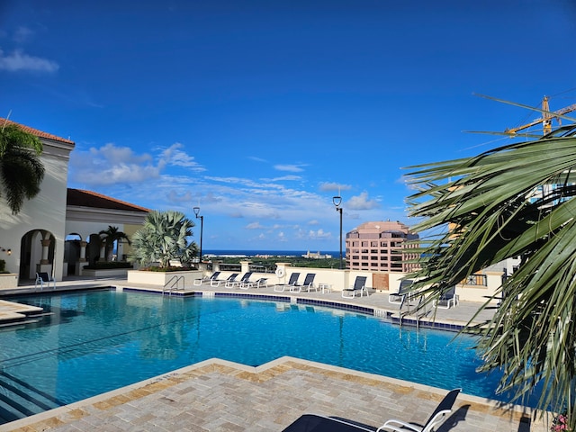 view of swimming pool with a patio area