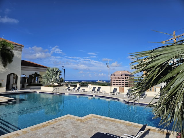 community pool with a patio area