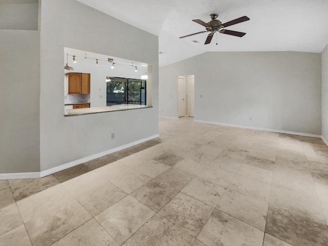 unfurnished living room with ceiling fan and vaulted ceiling