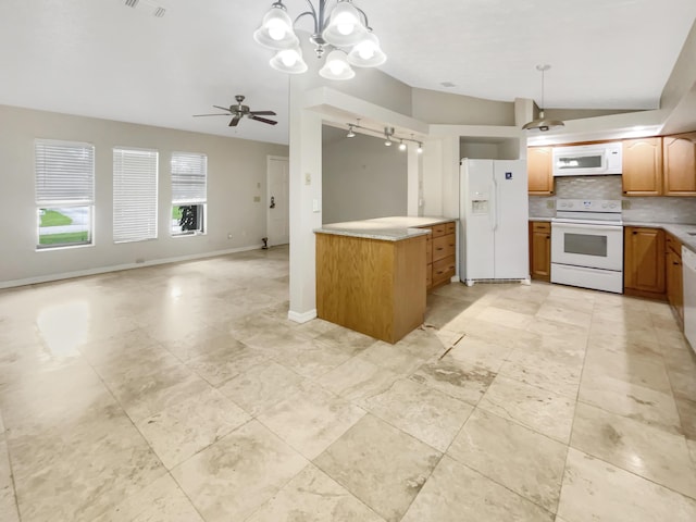 kitchen with white appliances, hanging light fixtures, ceiling fan, and decorative backsplash