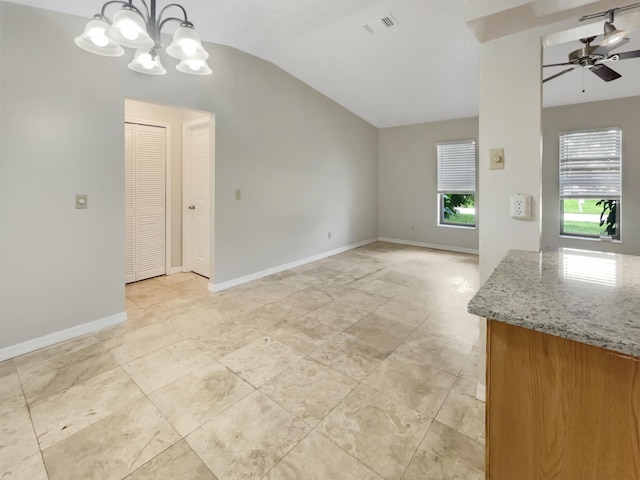 interior space with ceiling fan and vaulted ceiling