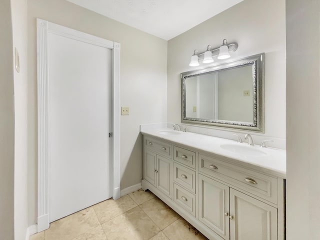 bathroom featuring tile patterned flooring and vanity