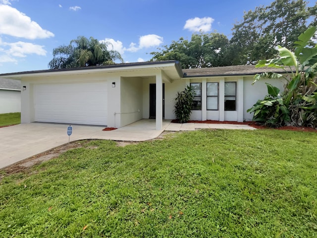 single story home with a front yard and a garage