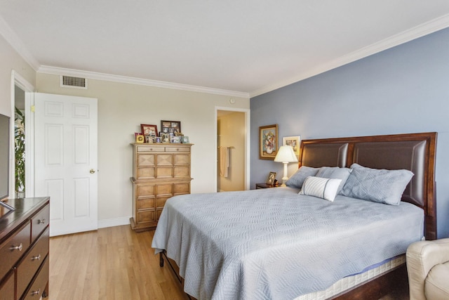 bedroom featuring light wood-type flooring and ornamental molding