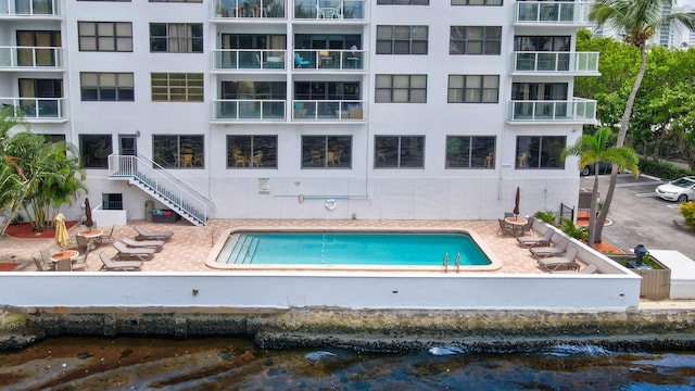 view of swimming pool with a patio area