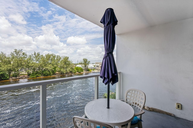 balcony featuring a water view