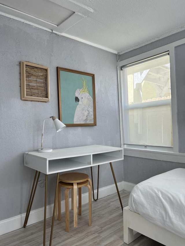 bedroom featuring hardwood / wood-style floors