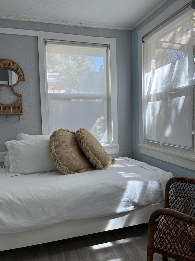 bedroom with hardwood / wood-style floors