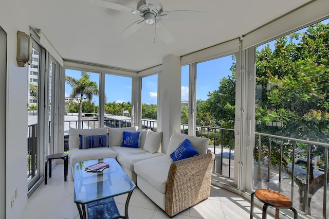 sunroom / solarium featuring ceiling fan