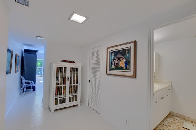 hall with light tile patterned flooring