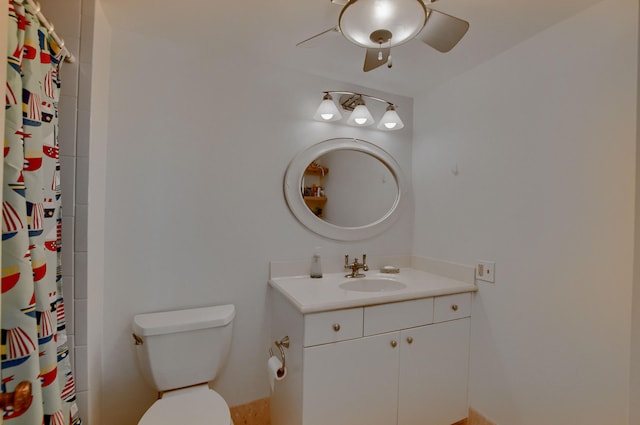 bathroom featuring ceiling fan, vanity, and toilet