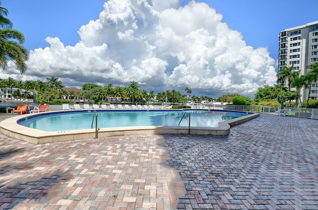 view of swimming pool with a patio area